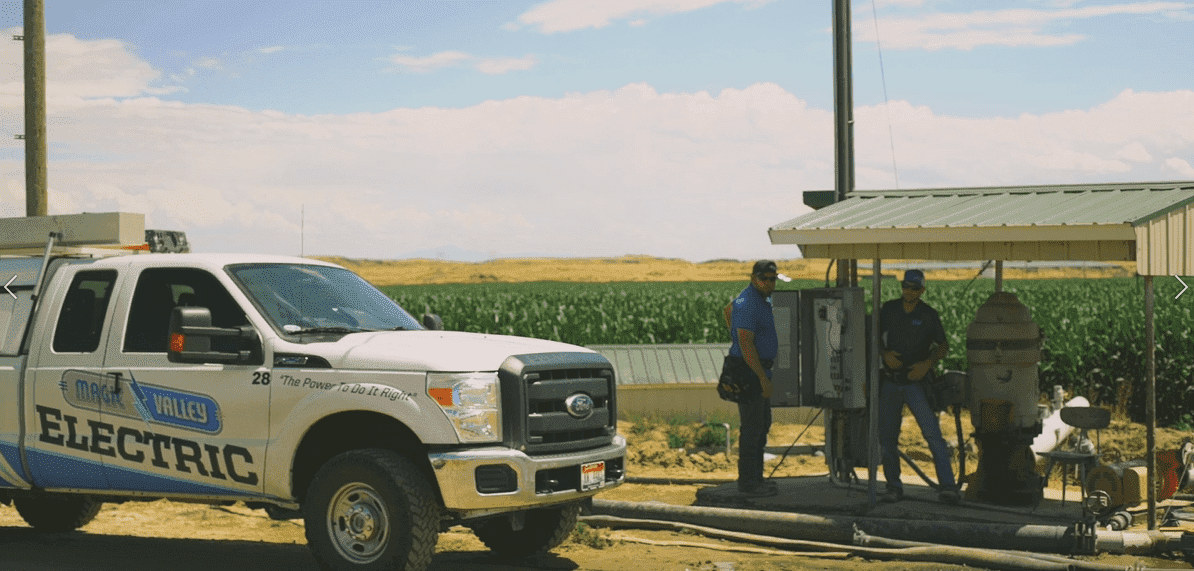 Magic Valley Truck - Two Men Working On A Panel 